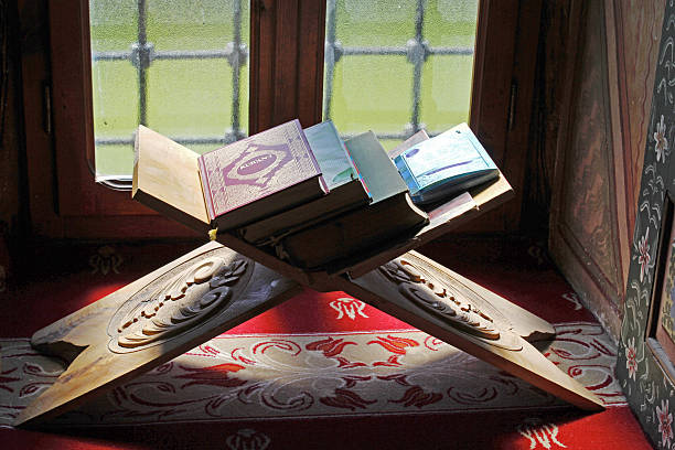 The Koran in the Sarena Dzamija Mosque in Tetovo A photo of the Koran on a stand at the Sarena Dzamija Mosque (Colored Mosque) of Tetovo, Macedonia. tetovo stock pictures, royalty-free photos & images