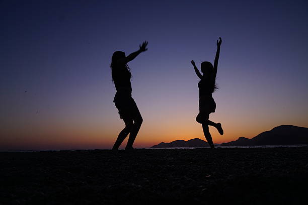 istock Young girls dancing on the beach. 537159526