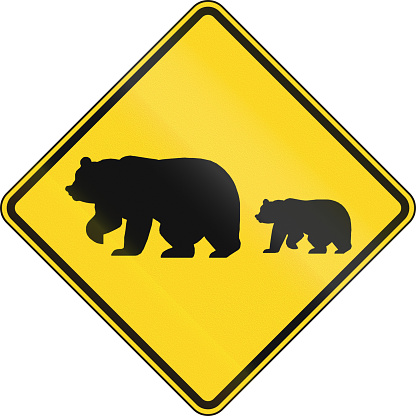 US warning traffic sign: Migrating bears.