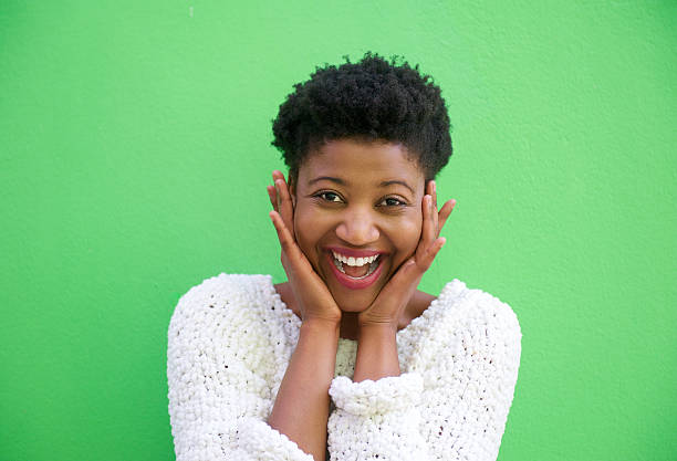 istock Surprised young woman smiling with hands on face 537173131