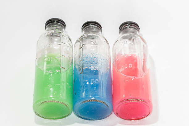 istock colored chemicals in glass bottles on a white background 537174959