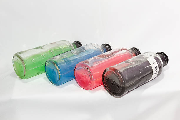 istock colored chemicals in glass bottles on a white background 537174965