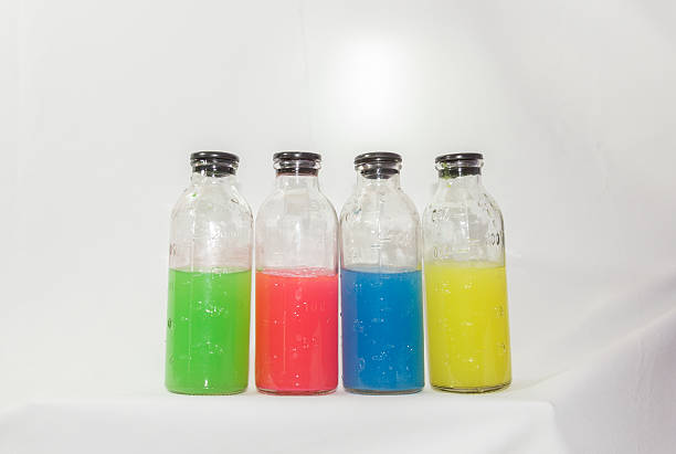 istock colored chemicals in glass bottles on a white background 537175419