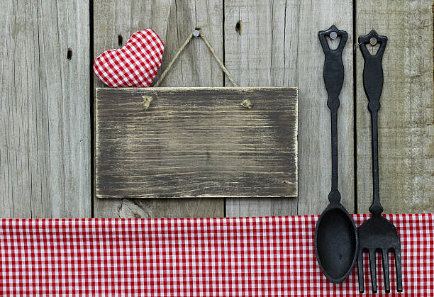 istock Blank sign with heart by cast iron spoon and fork 537175823