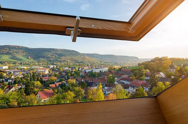 open roof window with view to village in fall - in Germany/ Thuringia