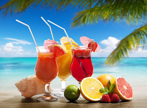 istock cocktaisl and tropical fruit on the beach 537177249