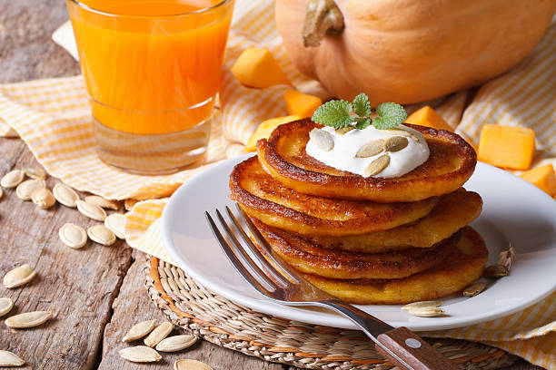 istock Pumpkin pancakes with sour cream and juice 537177253