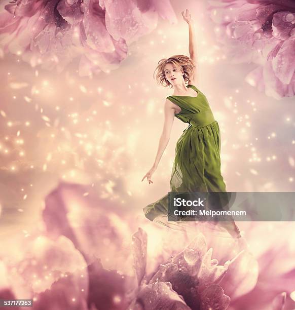 Beautiful Woman Jumping In A Pink Peony Flower Fantasy Stock Photo - Download Image Now