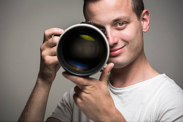 istock Young pro photographer with digital camera 537177275