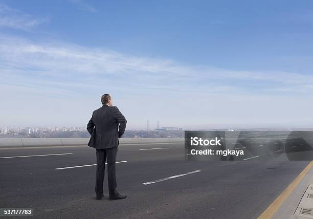 Businessman On The Highway Stock Photo - Download Image Now - Highway, Men, Standing