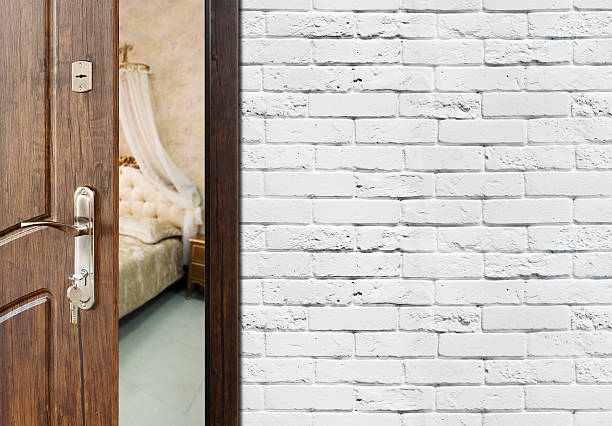 istock Half open door of a classic bedroom closeup. 537184552