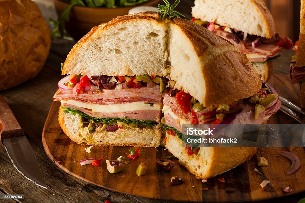Cajun Muffaletta Sandwich with Meat and Cheese Cajun Muffaletta Sandwich with Meat Olives and Cheese Provolone Stock Photo