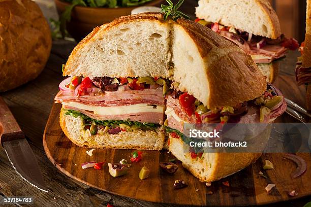 Cajun Muffaletta Sandwich With Meat And Cheese Stock Photo - Download Image Now - Provolone, Salad, Melting