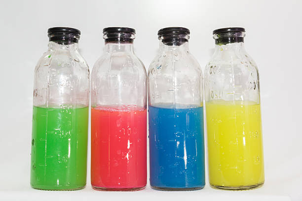 istock colored chemicals in glass bottles on a white background 537184901