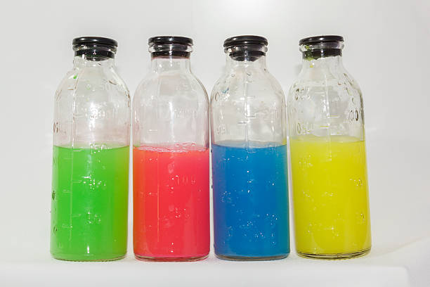 istock colored chemicals in glass bottles on a white background 537184911
