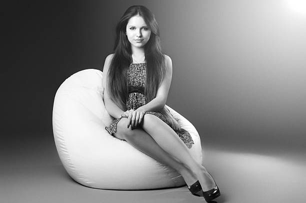 istock Girl sitting on a chair in the studio and posing 537185451