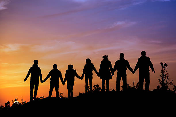 istock silhouettes of people on mountains 537186045