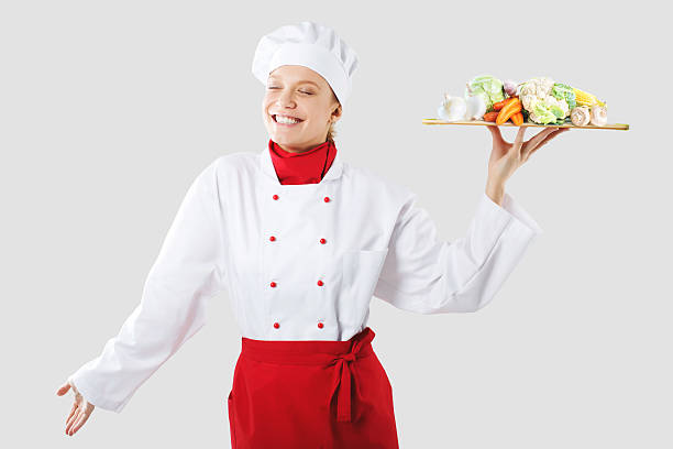 istock cook holds in one hand a wooden tray. 537186151