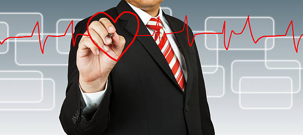 istock Businessman draw a pulse line with heart 537188323