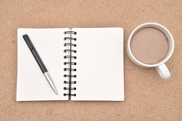 istock Blank Spiral Note Pad, Cup of Coffee on Wood Background. 537189141
