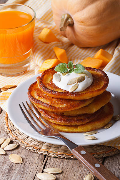 istock Pumpkin pancakes and juice closeup 537189361