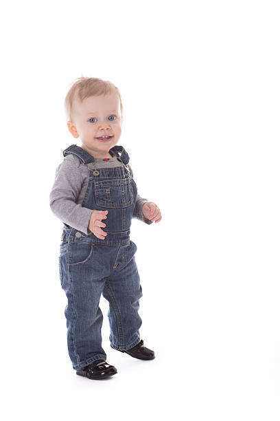 istock Baby girl in overalls 537189649