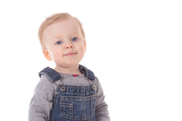 istock Baby girl in overalls 537190335