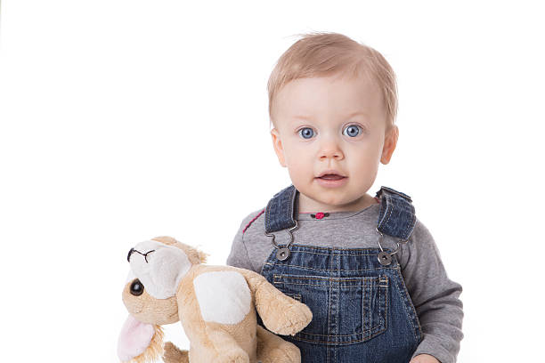 istock Baby girl in overalls 537190363