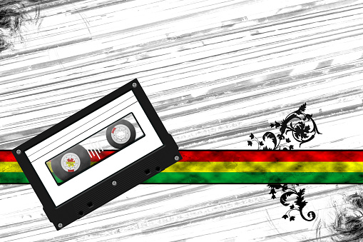 cassette tape with blank white lable on red yellow green banner, with album cover texture background, copy space