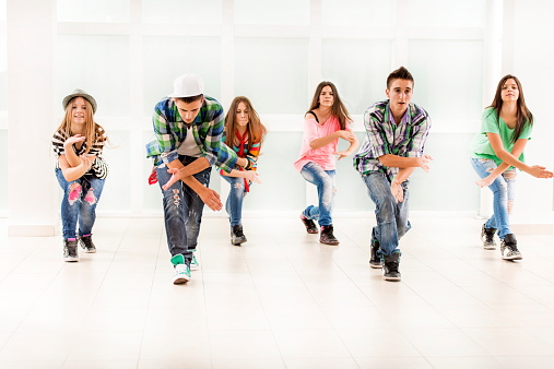 Group of teenage dancers exercising.  