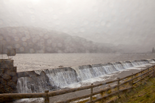 Rain and wind is whipping up the normally tranquil waters of the man made water reservoir in Talybont, Wales.
