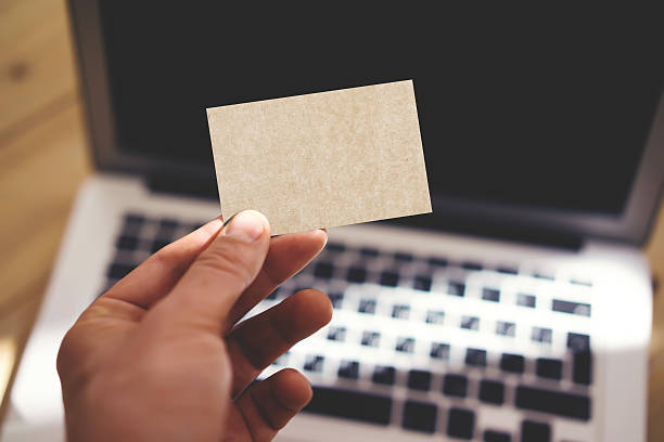 istock Photo Man Showing Blank Craft Business Card and Using Modern 537206942