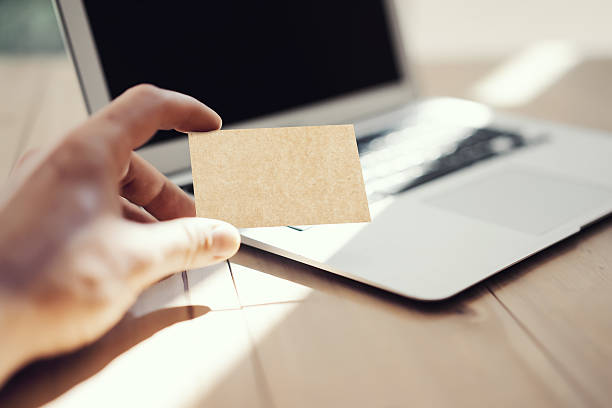istock Photo Man Showing Blank Craft Business Card and Using Modern 537207076