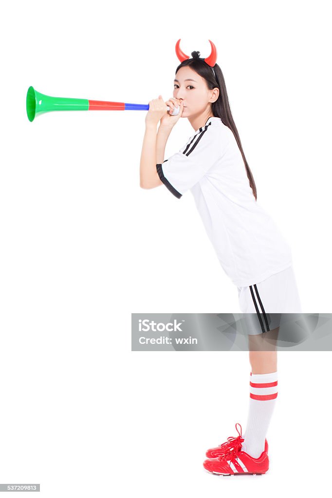 asian girl cheerleader, chinese uniformed cheerleader a pose with a megaphone isolated on white. Asia Stock Photo