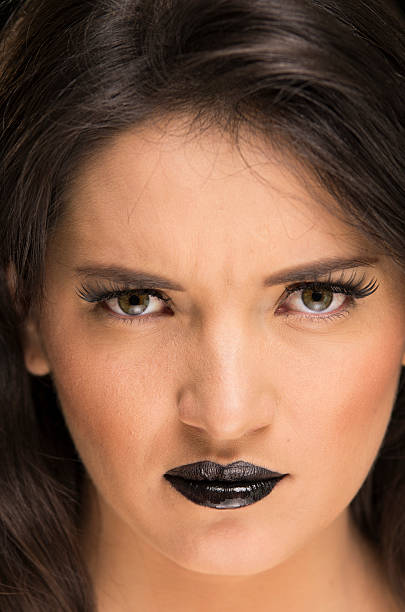 istock beautiful young woman wearing goth makeup 537210113