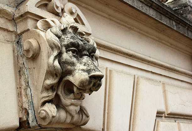 istock Old stone lion head fence detail 537211726