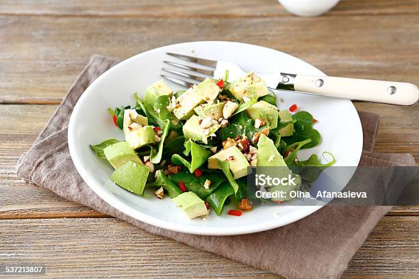 Salad With Avocado Spinach And Nuts In A Bowl Stock Photo - Download Image Now - 2015, Almond, Appetizer