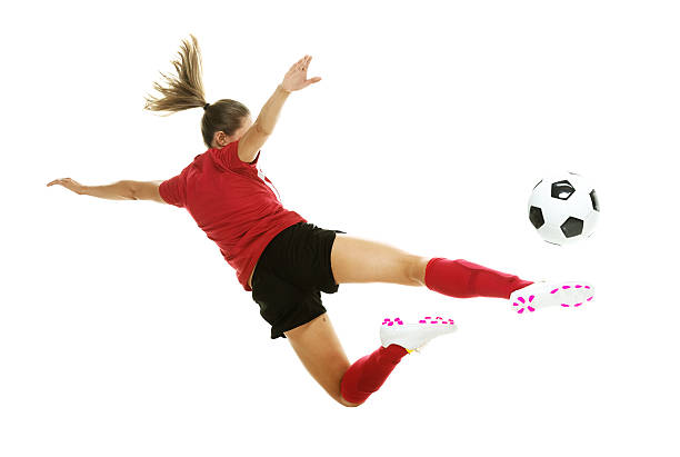 istock Female soccer player kicking the ball 537215383