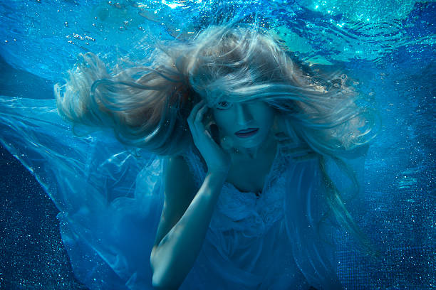 istock Fairy woman under water in a white dress. 537228014