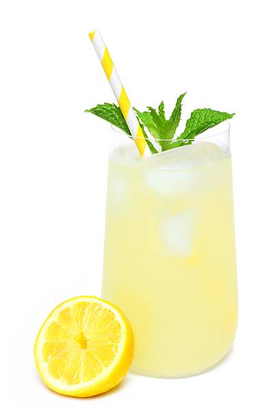 istock Glass of lemonade with mint and straw isolated on white 537228560