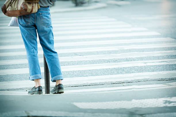 istock Motion blurred woman waiting to cross crosswalk 537228948