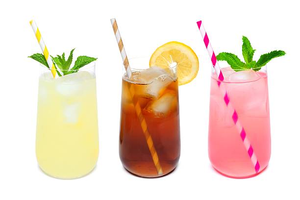 istock Three rounded glasses of summer drinks isolated on white 537229236