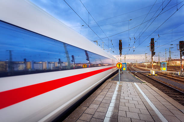istock High speed passenger train on tracks in motion 537229350