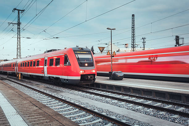 istock Railway station with modern red passenger train. Industrial landscape 537229644