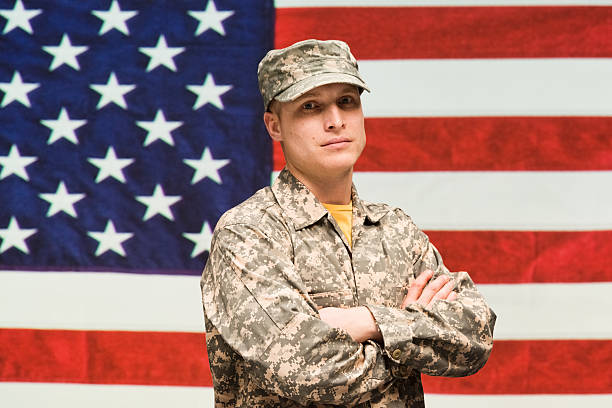 istock Soldier standing with arms crossed 537232420