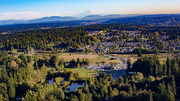 Bothell Mill Creek, Washington Suburbs Aerial - Mount Rainier Backdrop Bothell Mill Creek, Washington Suburban Forest Aerial - Mount Rainier and Cascade Mountains Backdrop puget sound photos stock pictures, royalty-free photos & images