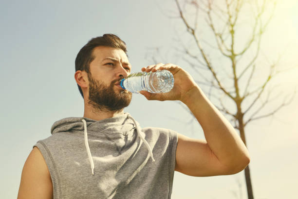 istock Photo of a Young Man Drinking Water 537238074