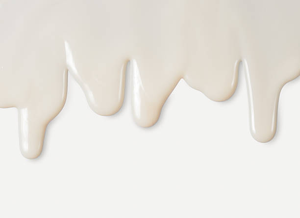 istock Dripping white milk, cream, paint yogurt on white background 537239352