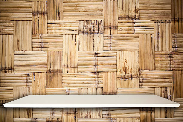 istock Empty top white shelves and woven wood background 537240302