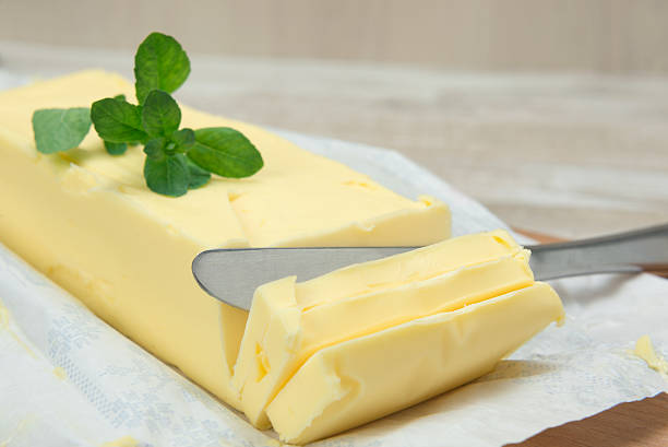 istock fresh butter in bar form and a knife 537243707